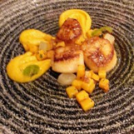Seared scallops, butternut squash purée, roast squash, pickled apple, and bacon crumb